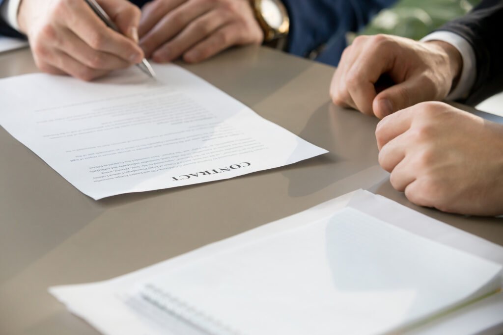 businessman signing contract at meeting, focus on document, clos businessman signing contract at meeting, focus on document, clos